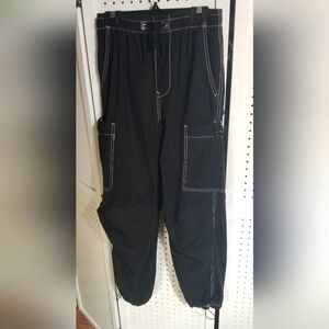 Black elastic waist track pants by Refuge